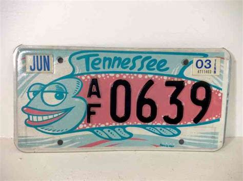Must be purchased prior to 16th birthday. Vintage Tennessee Friends of Art Silly Fish Liscense Plate
