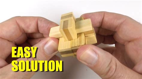 The puzzle consists of three wooden pieces (looks like stained radiata wood), namely an octagonal block attached by a rope to a long cylindrical rod. 6-Piece Wooden Cross Puzzle Solution - YouTube