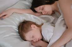 sleeping mom son together shutterstock