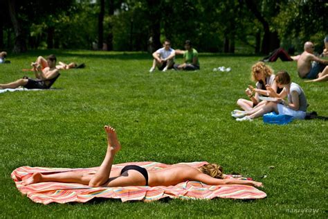 Create a relaxing getaway in your own backyard with the help of an outdoor fountain. Bathing Suits and Sunburns Exhibition - LENSCRATCH