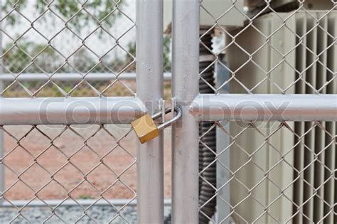 Hiring a handyman can cost as little as $15 per hour while a fencing installation professional charges $8 to $20 per linear foot or $25 to $50 per hour. Chain link fence and metal door with ... | Stock Photo ...