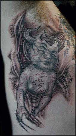 Haloed devil tattoo holds a great and deeper meaning. Tattoos - Demon baby - 35476