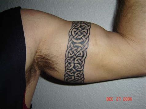 Other more macho designs for men include barbed wire, snake, celtic, and writing designs that wrap around the bicep. Celtic Armband Knotwork tattoo | Arm band tattoo, Band ...