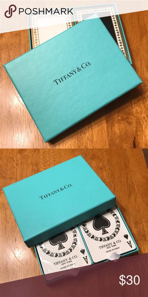 This vintage set of tiffany and co., playing cards, features 2 decks of playing cards with the jokers, one is still sealed in the cellophane wrapper. Tiffany & Co. playing cards | Tiffany & co., Playing cards, Tiffany