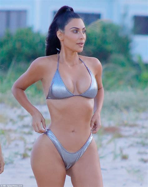 Micro bikinis with hot cameltoe. Kim Kardashian flaunts her banging body in sexy silver ...