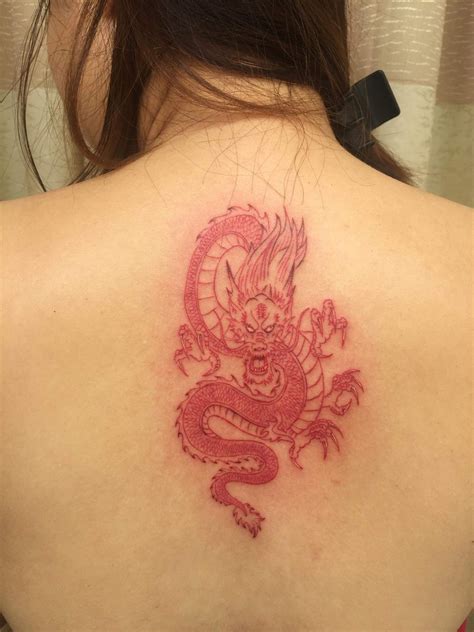 What does a red dragon tattoo mean? Red dragon tattoo. | Bow tattoo designs, Red dragon tattoo ...