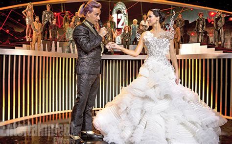 Glue gun wings to the dress. The Hunger Games: Catching Fire Image Shows Off Katniss's ...