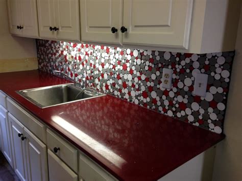 The laundry room is a multifunctional place, which allows storing things as well as taking care of your watching by incorporating the metallic, finish backsplash ideas a simple looking laundry room can be you can choose to go with modern and elegant elements or tones to bring in a perfect finish. Red Laundry Room With Custom Backsplash matches washer and ...