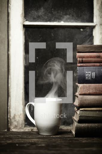Then it asks carriers to bid on your shipment. Steaming cup of coffee on a wood table next to... — Photo ...