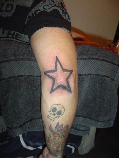 This tattoo includes grey ink, which makes it more dramatic and bold. Star Elbow Tattoo by giraffechick on DeviantArt