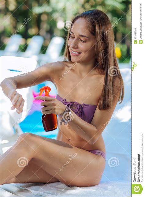 Tiff love videos & images. Slim Beautiful Dark-haired Woman Sunbathing Near The Pool ...