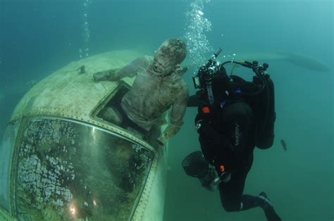 The shaky mobile video entitled 'it's raining bodies' has been released. extracting corpse from underwater airplane wreck, training ...