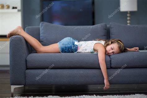 By darcness, may 22, 2009 in depression central. Girl sleeping on sofa in living room — Stock Photo ...