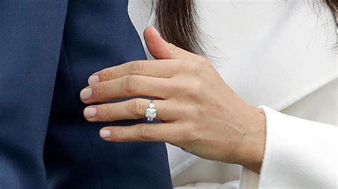 Meghan markle's ring on her engagement day (left) and during trooping the colour (right). Markle engagement ring has 2 of Diana's diamonds | WJLA