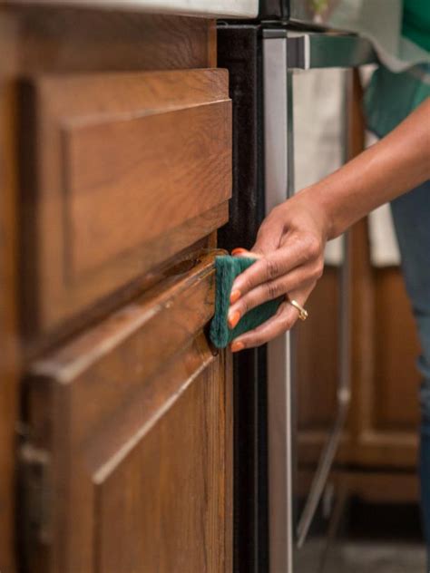 Apply two layers of finish for the best look. How to Paint Kitchen Cabinets Without Sanding or Priming | HGTV | Painting kitchen cabinets, Old ...