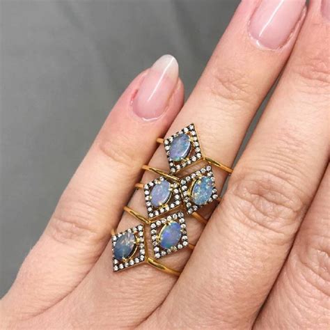 There's a really pretty play of light blue colors in the side stones and the weaving band, combining various shades of. 14k gold vermeil australian blue opal and diamond ring by carrie elizabeth jewellery ...