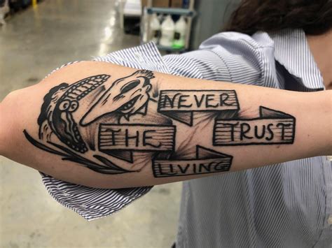 Always thought it was odd that it changed on once you notice that, it allows the tattoo to be read never trust the living or the living never. Never the trust living : facepalm