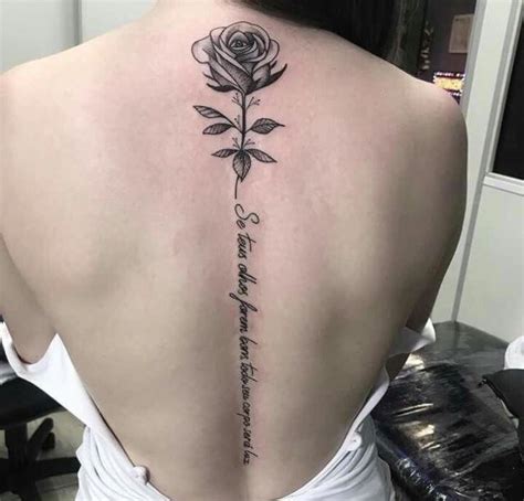 'xxx' tattoo on the left side of her back. Pin by emmy brown on Tattoos in 2020 | Flower spine ...