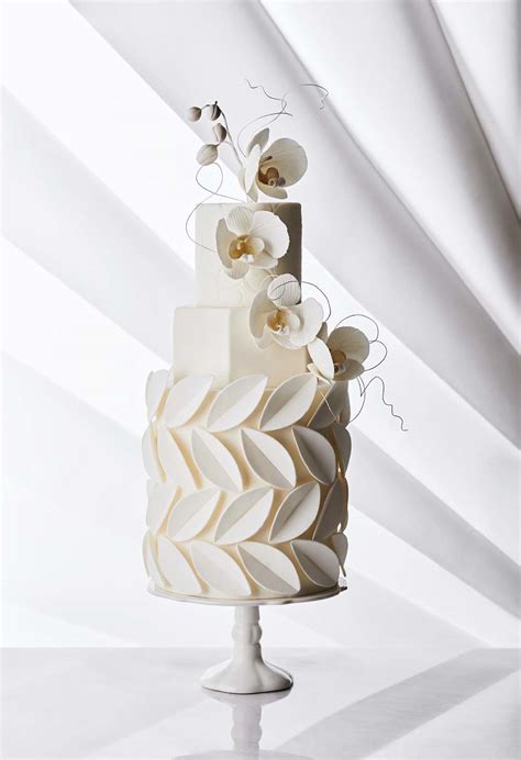 White flower wedding cake w/ black frosting. Four Unique Takes On The Traditional White Wedding Cake ...