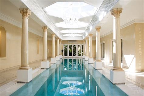 Keeping wet feet and dripping swim suits out of the house lets kids enjoy the pool without risk of ruining the indoor furniture. Deluxe Indoor Pool Decorating Idea showing Lap Pool and Classical Roman Column Decorations also ...