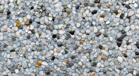 Small river pebbles are mixed with portland cement and dye at the truck. Blue Lagoon - Schilli Plastering