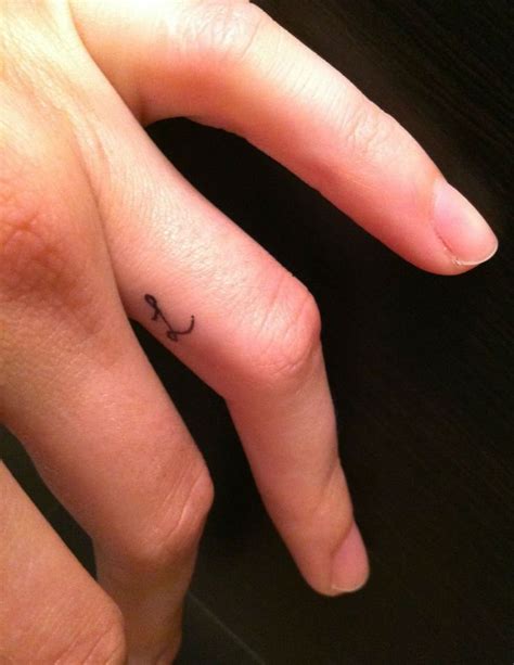 Beautiful cross tattoo on finger. 31 Cool Inner Finger Tattoos to Inspire You