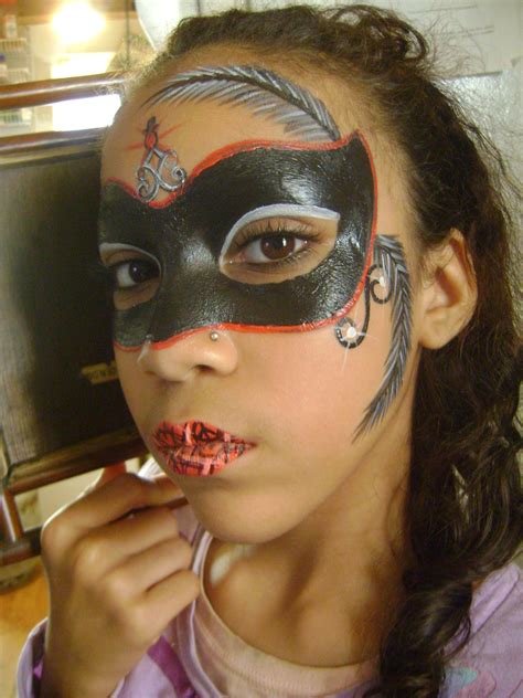 Put copious amounts of glue where you want glitter. My daughter with a face painted masquerade mask I did ...