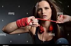 tied rope woman beautiful young red alamy