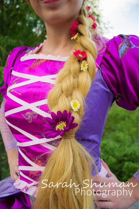 Disney princess with pink flowers in hair. Rapunzel cosplay princess disney tangled flowers long ...