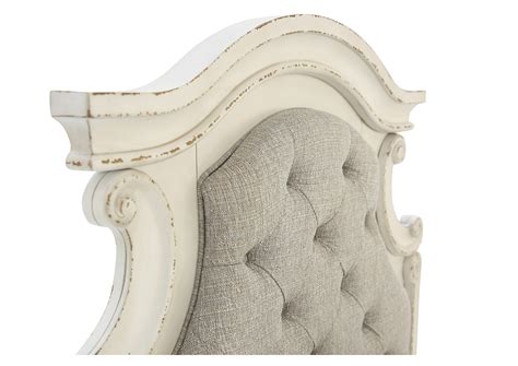 A curvaceous beauty, this brilliant upholstered bed wows with dramatic scalloped details and fanciful trim work and charms with a distressed chipped white finish for heirloom appeal. REALYN TWIN PANEL BED Ivan Smith