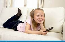 little girl happy blond sofa internet app mobile phone using