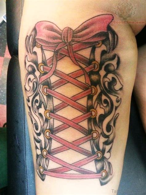 This is a partially spread tattoo. 36 Attractive Corset Tattoos On Leg