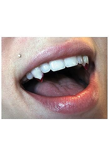 Via a slip on, permanently or caps. Small Blood Tip Vampire Fangs