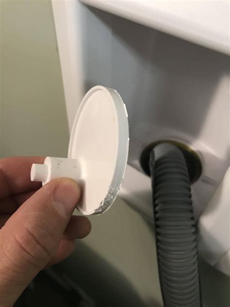 The adhesive will slowly loosen. How do i remove the caps in the washer drain, MISHKANET.COM