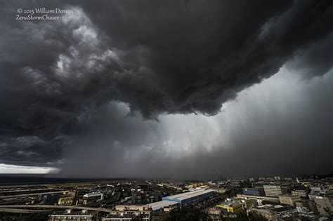 A strong downward current of air from a cumulonimbus cloud, which is usually accompanied by intense rain or a thunderstorm. Il downburst