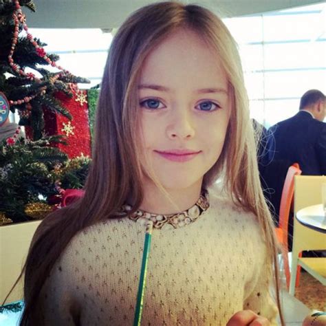 Tee ngirl sitting on old cart at train station. 12 pictures of world's most beautiful girl - Kristina Pimenova | IndiaToday