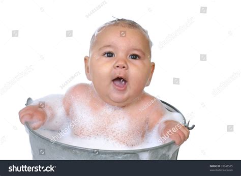 At least for the first couple of times, recruit someone to help out during baby's bath time. Six-Month-Old Baby Girl In Bubble Bath, Isolated On White ...