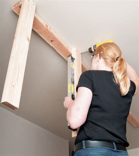 I made marks on the walls and attached one of the. How to Install Overhead Garage Storage | DIY | STANLEY ...