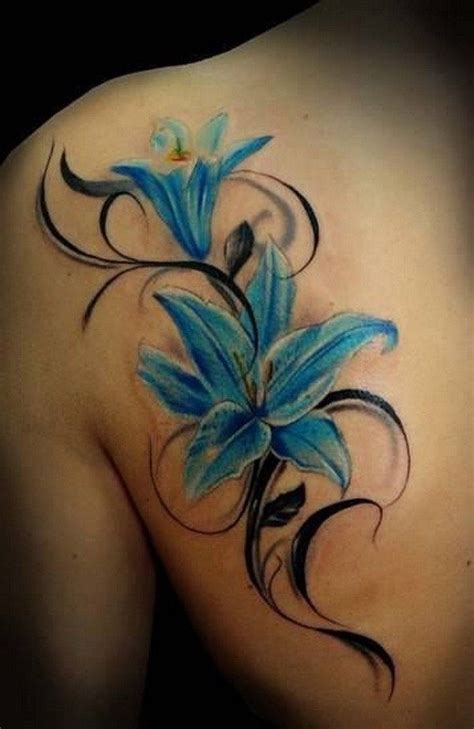 Christians consider the lily to be a symbol of innocence, chastity, purity, and piety. Blue Lily Flowers Tattoo On Left Back Shoulder | Lily ...