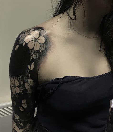 White ink over black tattoo. These Striking Solid Black Tattoos Will Make You Want To ...