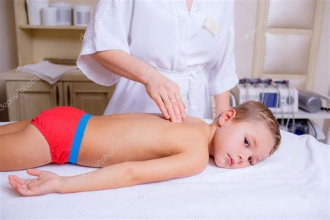 Japanese massage relaxing muscle and relieving stress full b. Doctor massaging little boy — Stock Photo © HannaNes #49026383