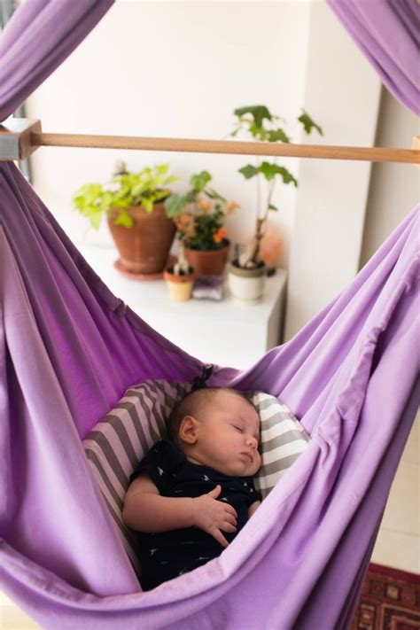 Tie all the rolled diapers with a metal wire and stuff it into the tissue holder and put it in the vase. Baby Hammock, Baby Swing, Baby Shower gift, Unique Baby ...
