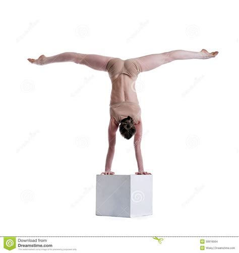 Keeping flexible is a great way to stay in shape. Flexible Woman Posing Doing Exercises On Cube Stock Photo ...