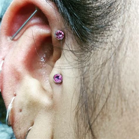 Piercing the cartilage opposite the tragus, usually with a barbell. Closeup Anti Helix Piercing | Piercing Time