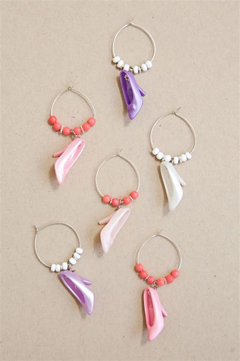 They slip right onto the stem of your glass with a little. Learn to make these adorable Barbie Shoe Wine Charms! | Wine charms, Wine glass charms, Bridal ...