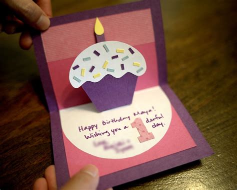 Make a few simple cuts into a piece of decorative paper to create a tab. paper and plates: Cupcake Pop-Up Card