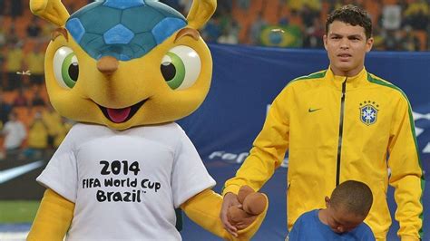 It also said that the 2022 world cup countdown will happen in november. Brazil's defender Thiago Silva (R) holds hands with the ...