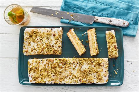 Add the double cream, half at a time, and mix to a thick spreading consistency. Lemon Pistachio Slice | Lemon curd, Pistachio, Lady finger ...