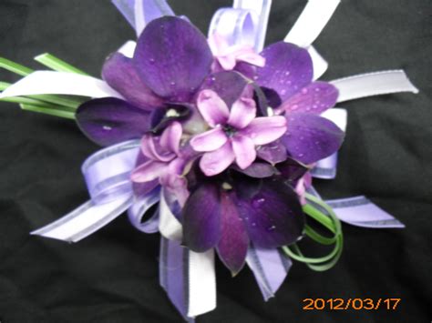 Wedding flowers are one of the most stand out elements to your with big delicate blossoming petals, peonies work great paired in a bouquet with other cream this romantic and ruffled flower comes in a range of colors from pink to purple to white. Purple flower corsage for wedding, events and prom ...