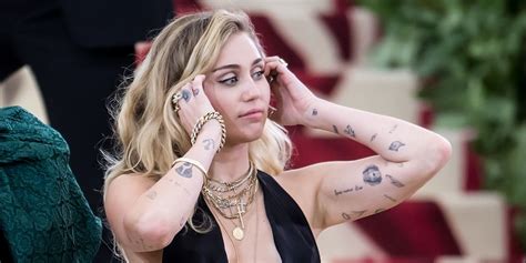 Select from premium miley cyrus tattoos of the highest quality. Miley Cyrus's Tattoos - Photos and Meaning of Miley Cyrus ...